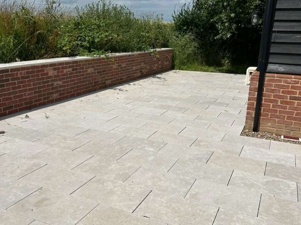 Brick garden wall with patio in Suffolk