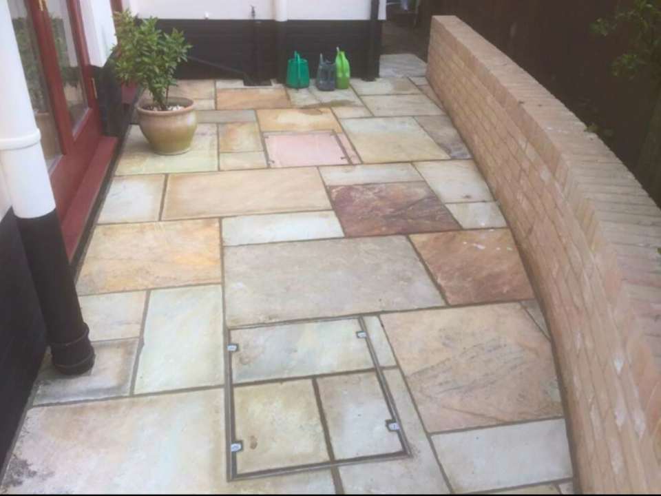 Patio with brick border design in Suffolk